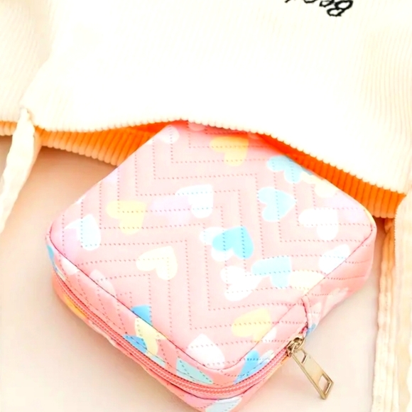 Handbags - Brand new heart print sanitary napkin bag.